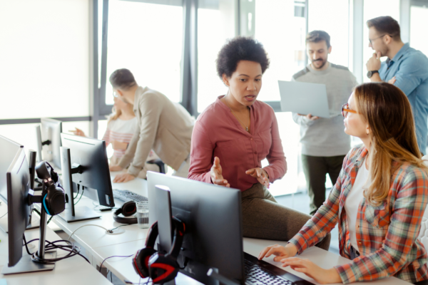 startup founder handing sales playbook to first salesperson